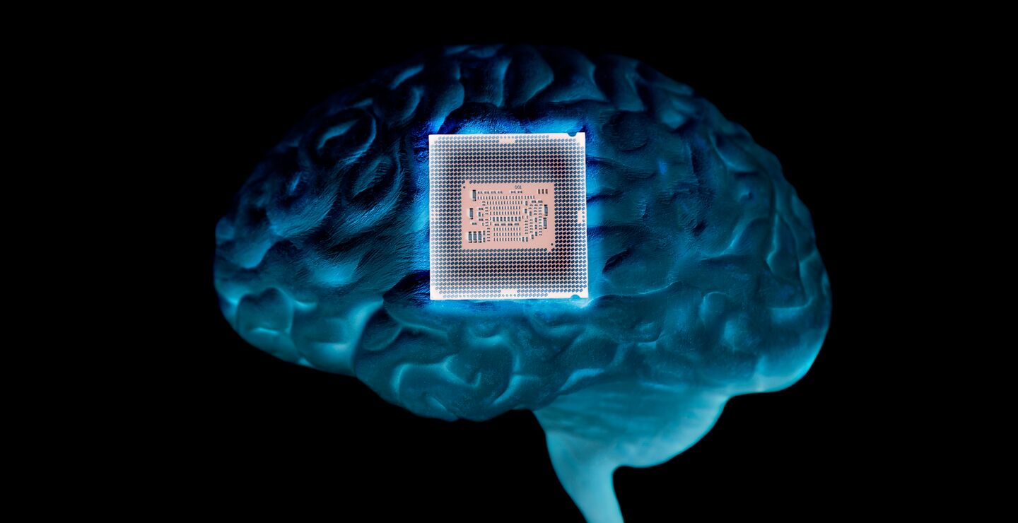 Image of computer chip overlaid on an illustration of a brain