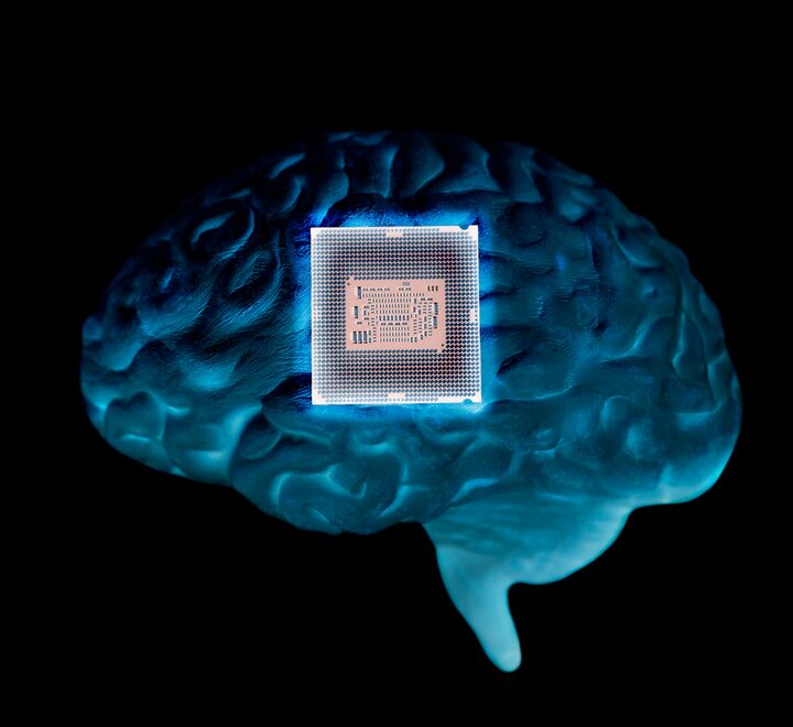 Image of computer chip overlaid on an illustration of a brain
