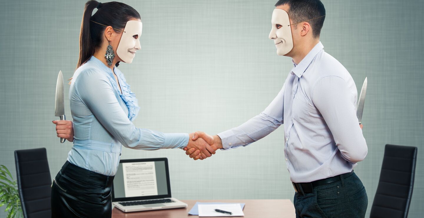 Woman and man both wearing masks,  shaking hands.