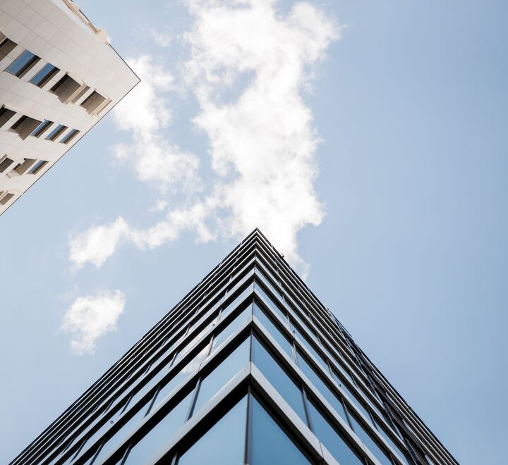 The upper corner of a modern building