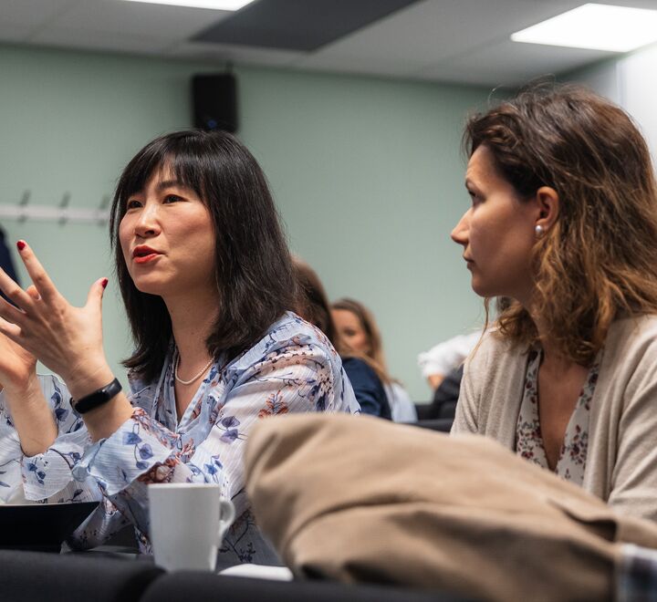 Image of to women from the audience speaking