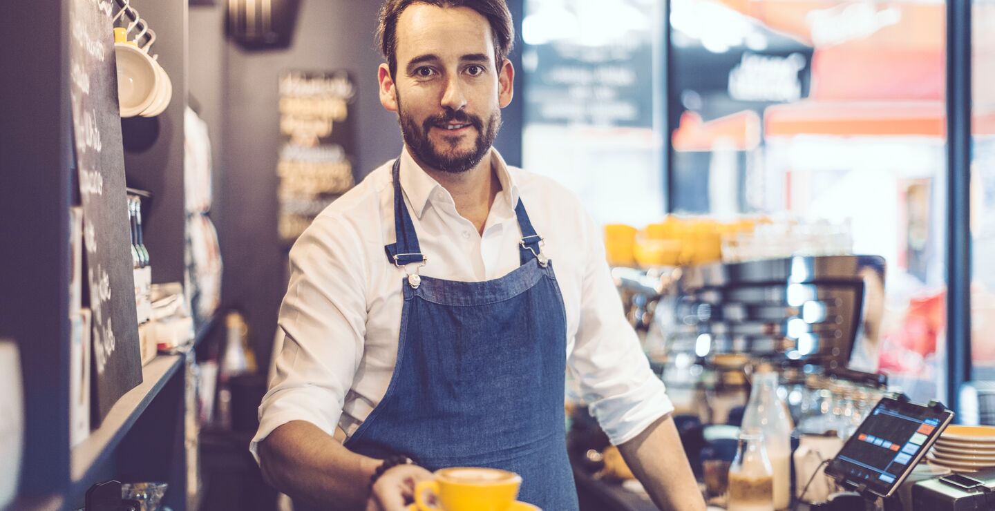 A barista (pictured) serving specialty coffee, which new research claim is a drink we enjoy more in certain atmospheres.