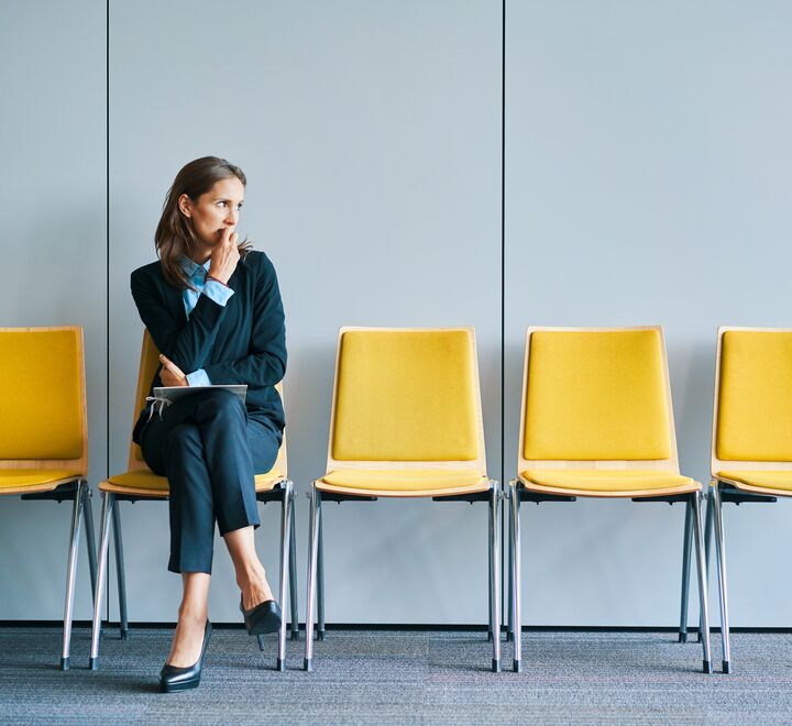 Stressed woman in job interview.