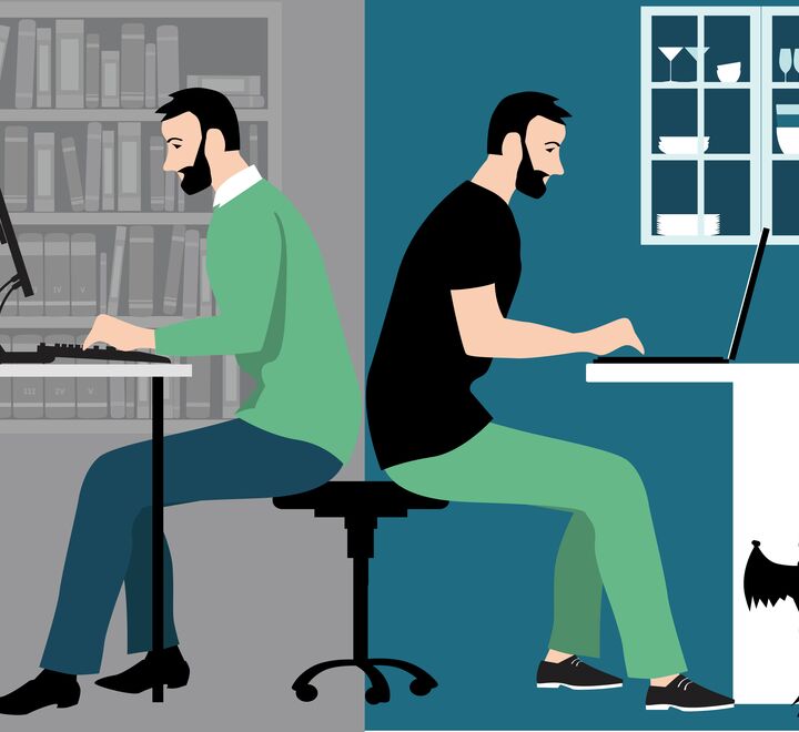 Man in hybrid work place sharing his time between an office and working from home remotely.