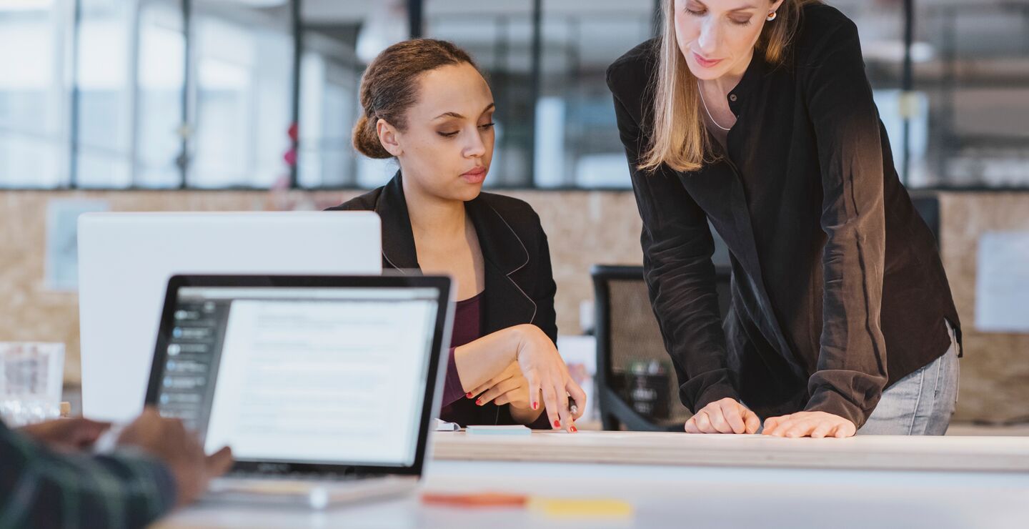 Two women working together