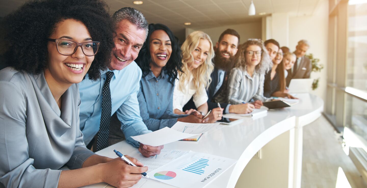 Forbes Magazine recently reported that first-generation American migrants were starting businesses at over twice the rate of natives. (Illustrationphoto of a group of peple with cuktural diversity).