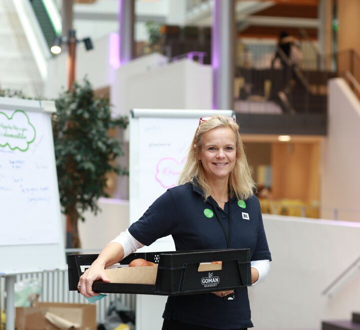  An adviser handing out buns