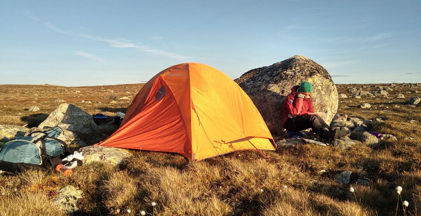 Girl outside with a tent