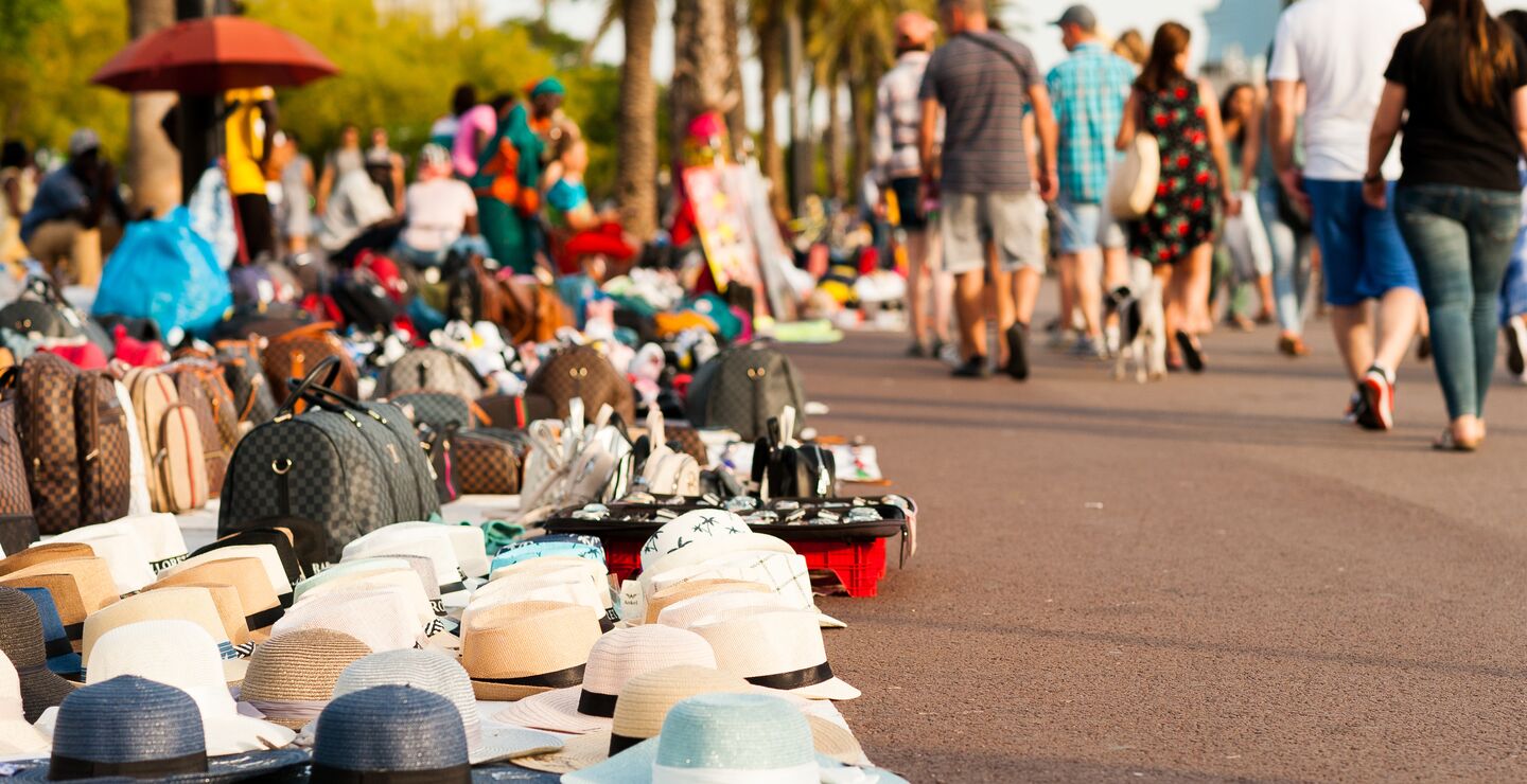 Counterfeit goods displayed on sidewalk in Barcelona