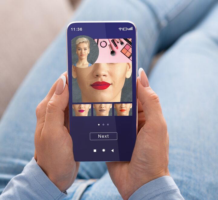Woman trying different lipsticks with an app