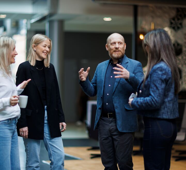 A man with his bicycle, looking up towards the sky