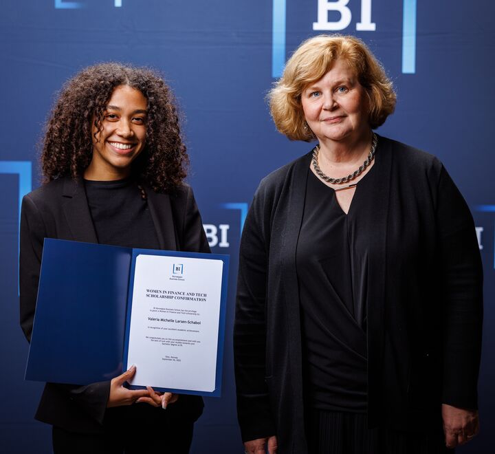 Scholarship confirmation ceremony 2022 with a student and President Karen Spens.