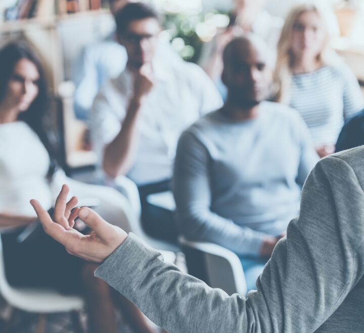 A man speaking during a workshop