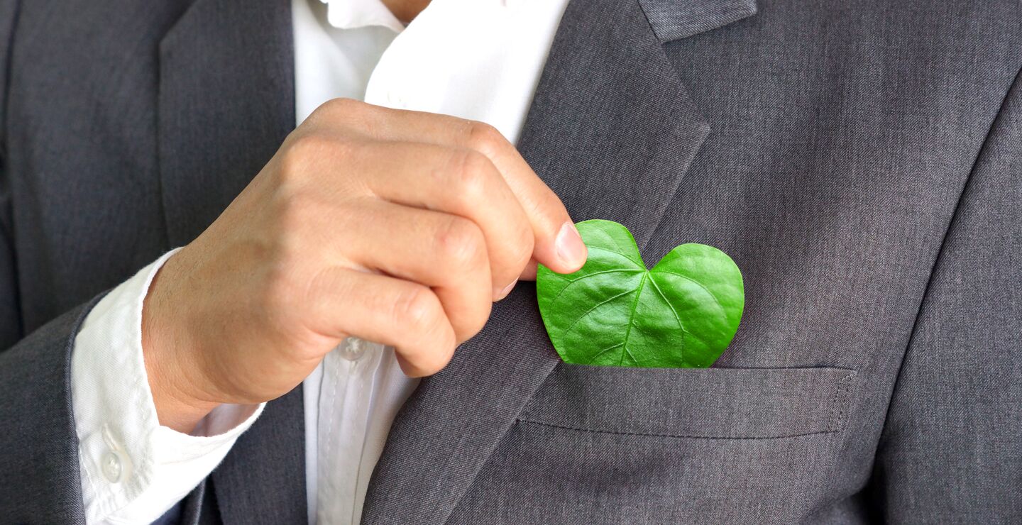 Guy with a heart-shaped green leaf in his suit pocket