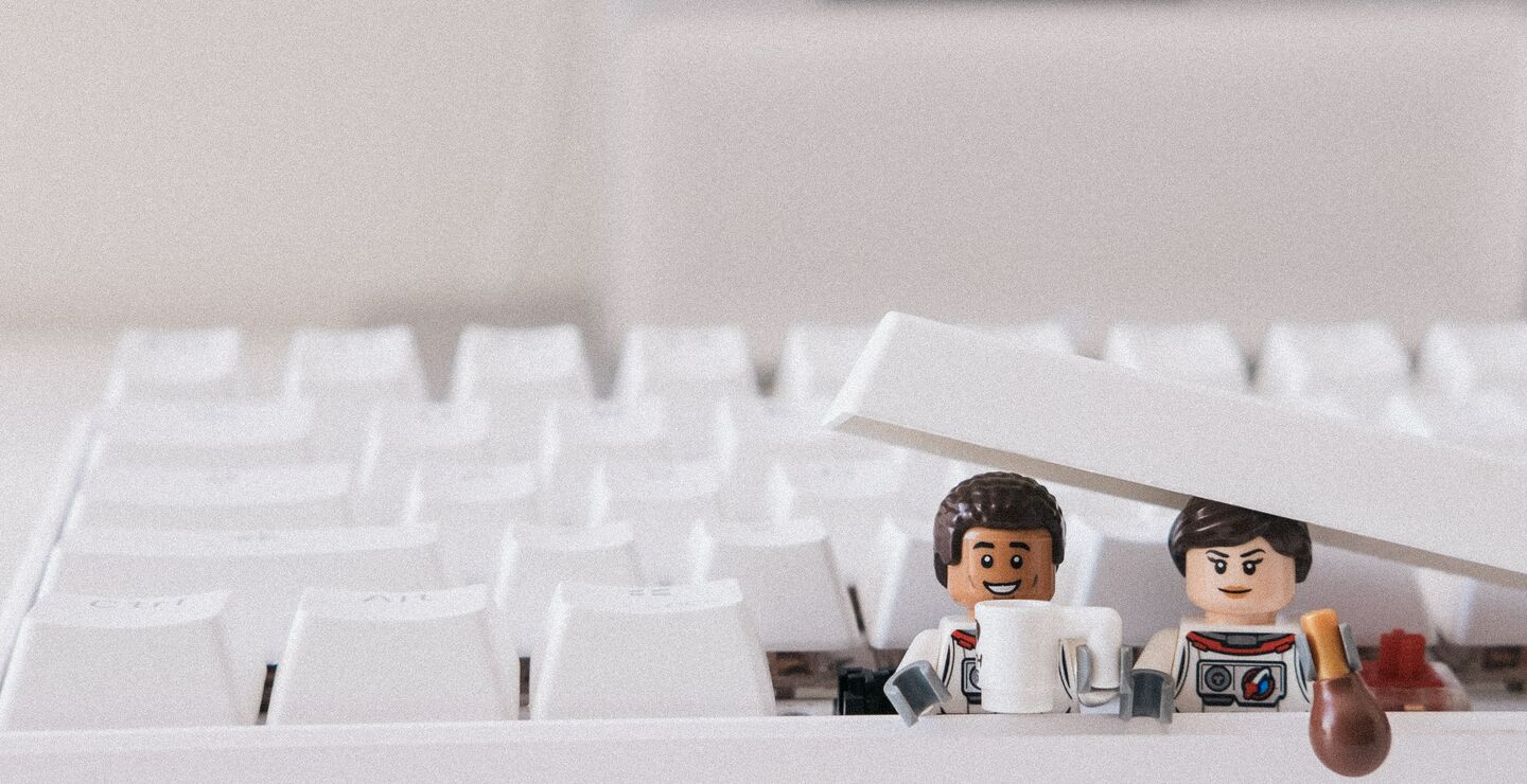 Lego figures under a  keyboard button