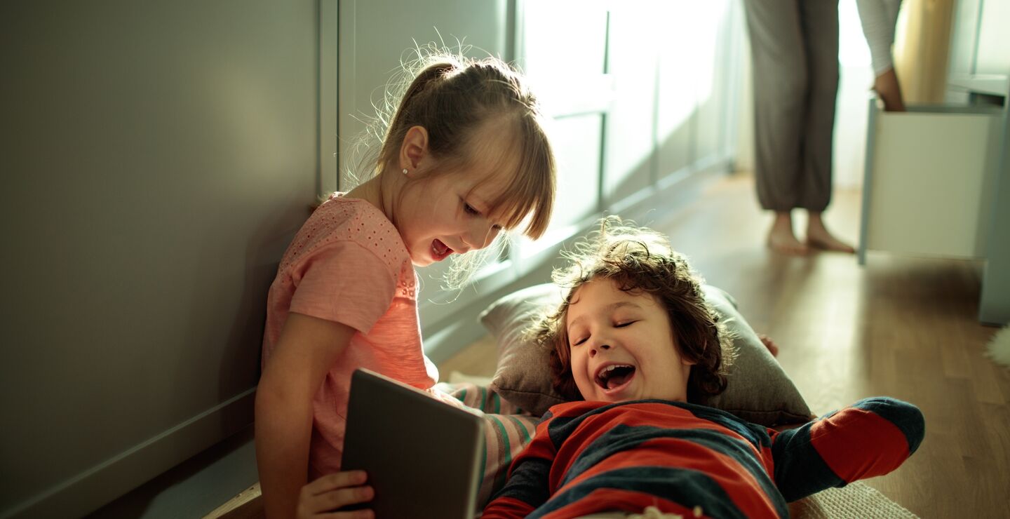 Our everyday lives is becoming more and more digitised (kids on tablet pictured). 