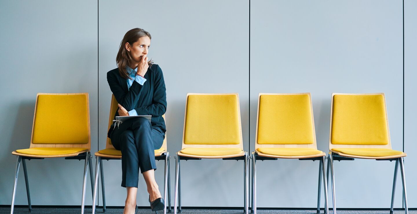 Stressed woman in job interview.