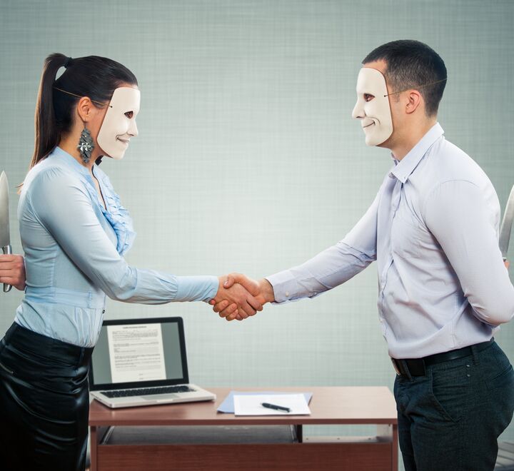 Woman and man both wearing masks,  shaking hands.