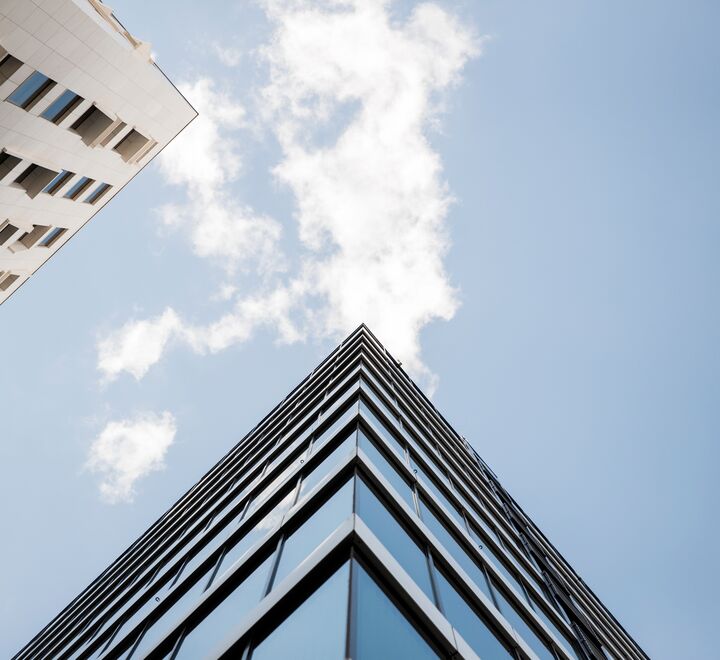 The upper corner of a modern building