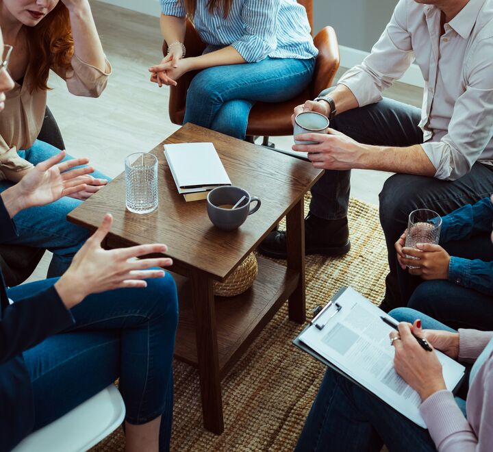 People sitting around a table and discussing