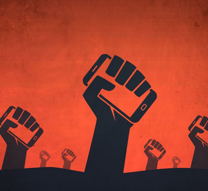 Illustration of fists holding mobiles