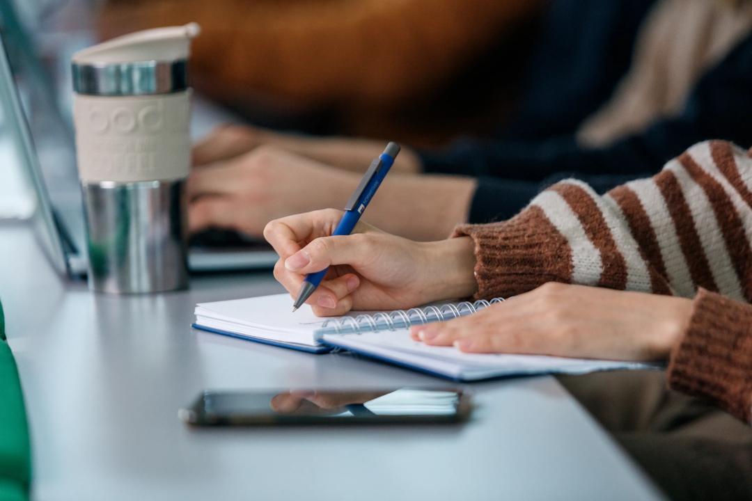 Student writing notes