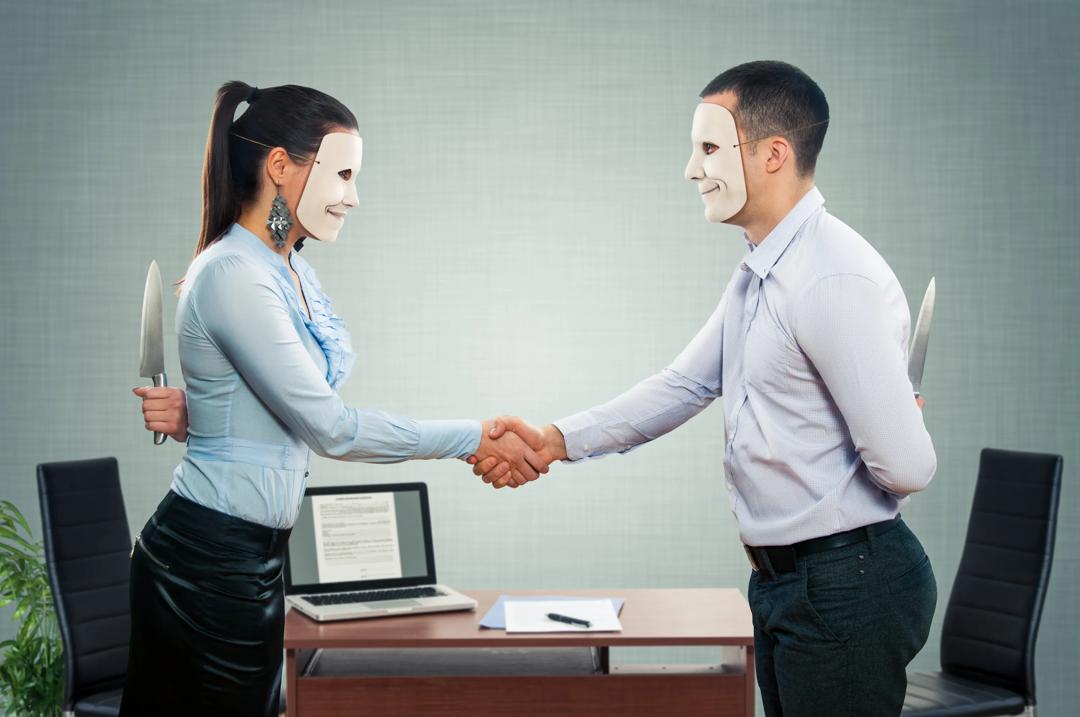 Woman and man both wearing masks,  shaking hands.