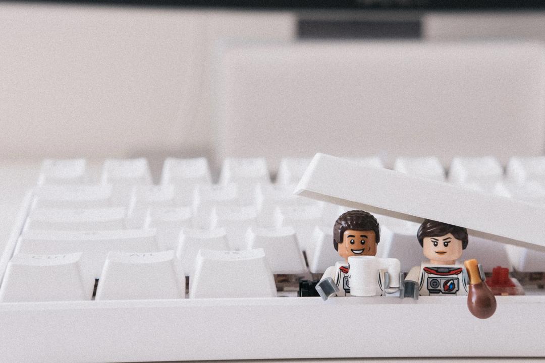 Lego figures under a  keyboard button