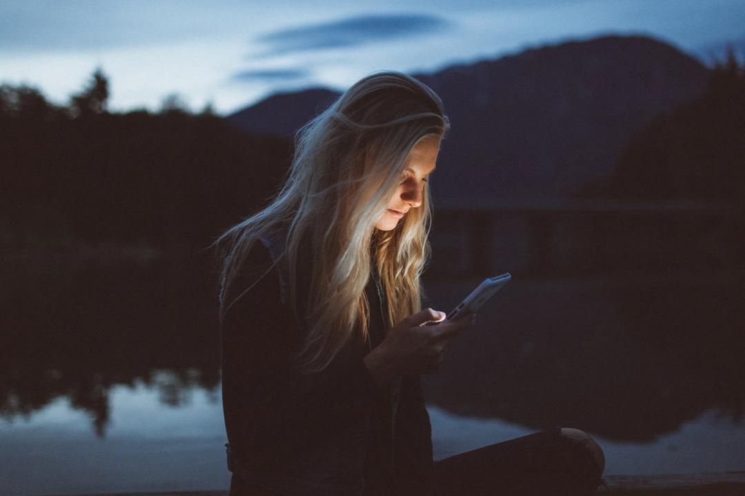 Koen Pauwels has researched apps (woman on phone pictured), to discover what makes customers buy products. Picture: Becca Tapert (unsplash)