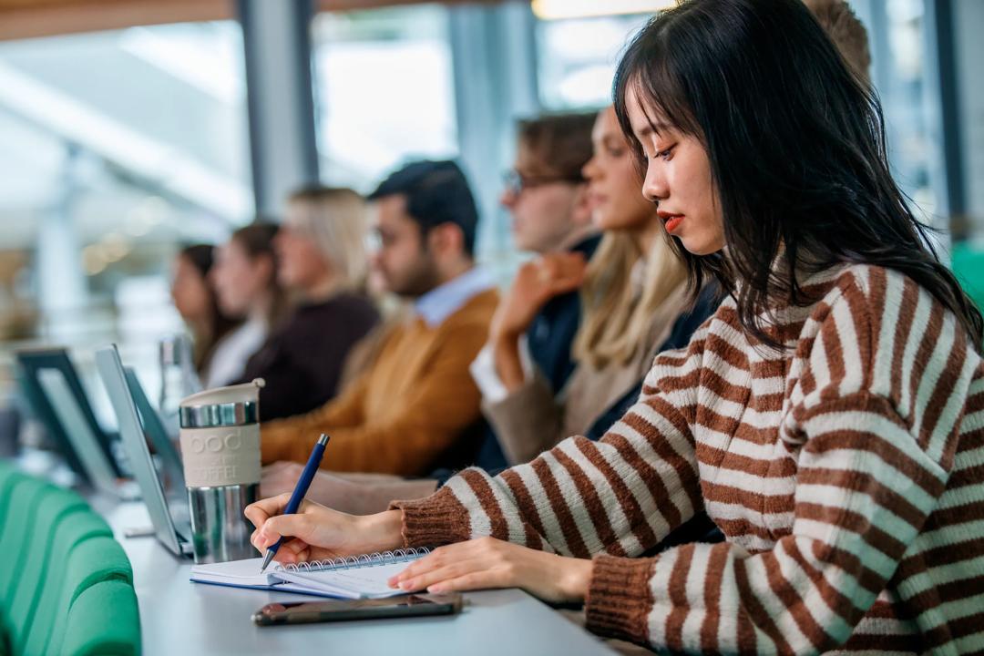 Students during a lecture in an auditorium