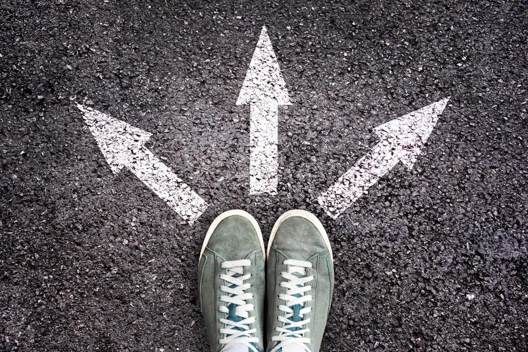 Shoes and arrows pointing in three directions