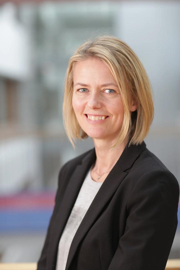 A woman smiling