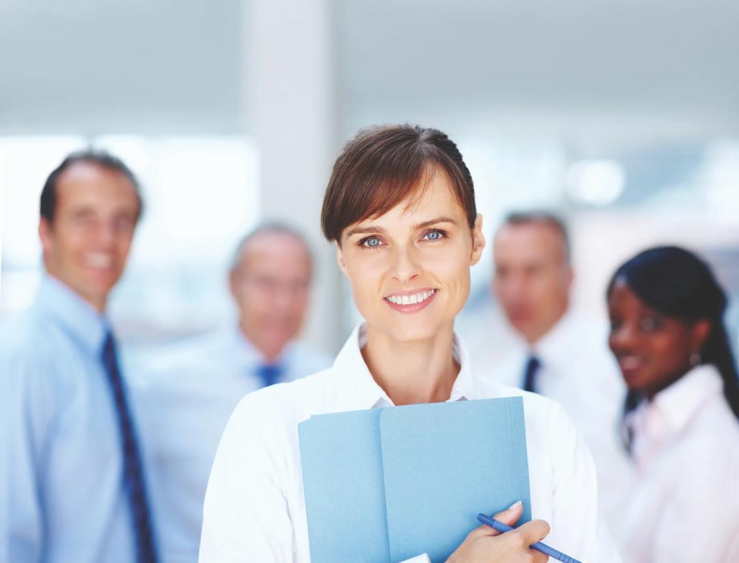 A doctor with a group of doctors behind her