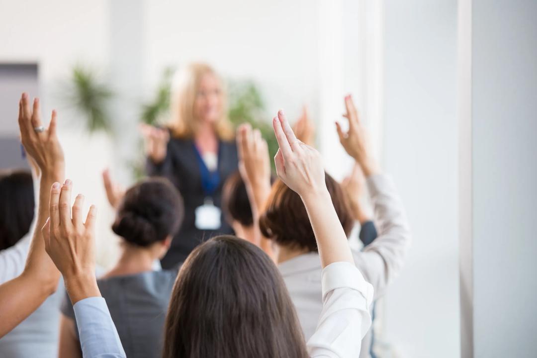 People raising their hands