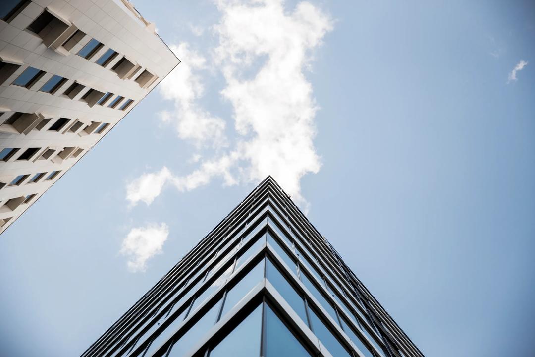 The upper corner of a modern building