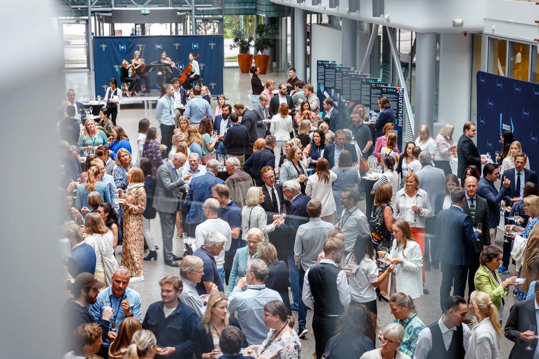Crowd of people drinking and eating