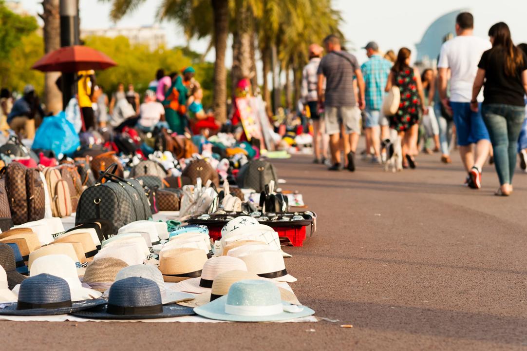 Counterfeit goods displayed on sidewalk in Barcelona