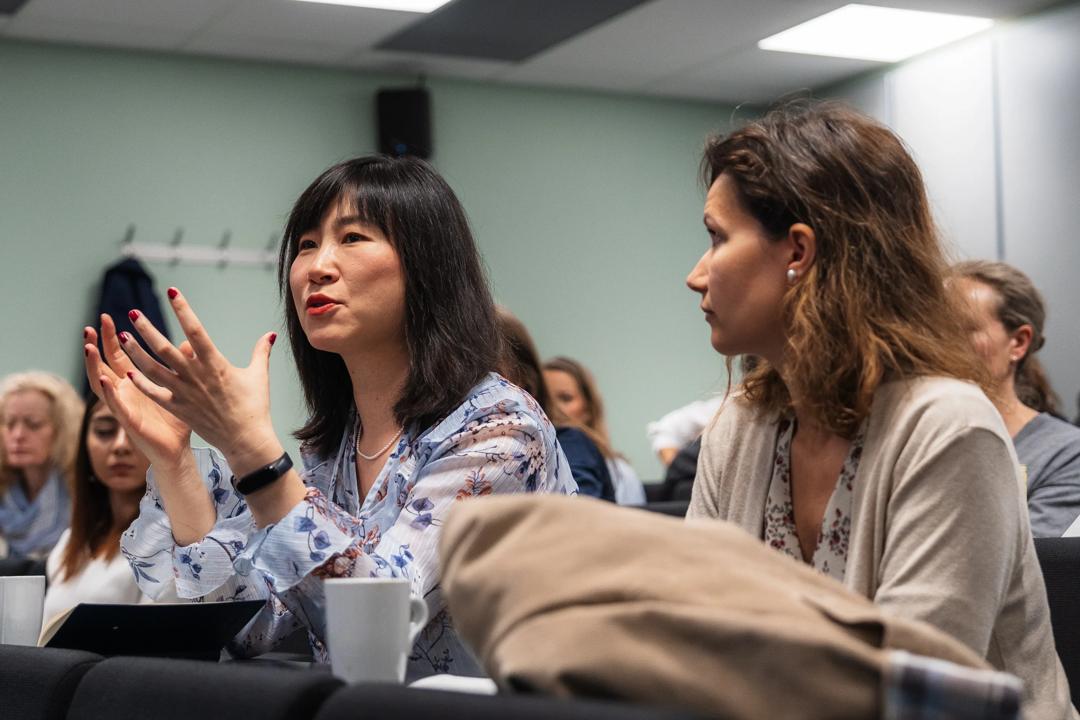 Image of to women from the audience speaking