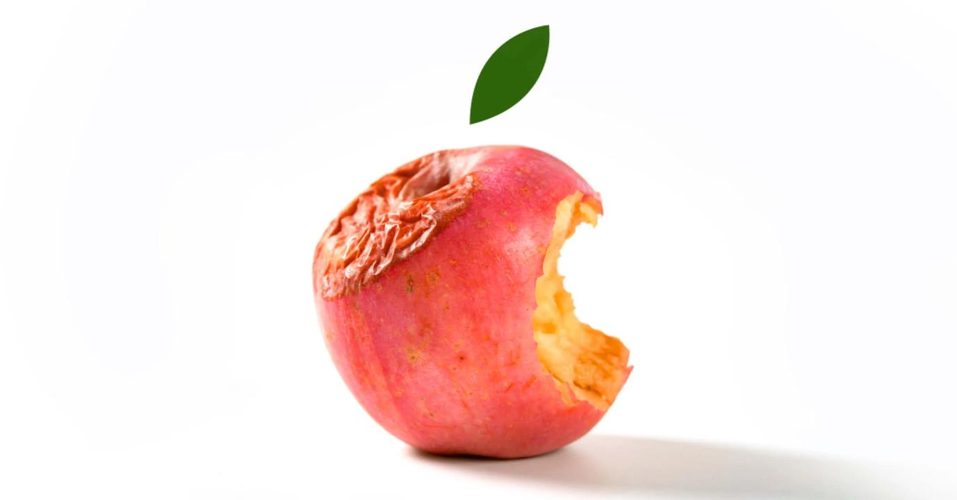 An rotten red apple with a bite