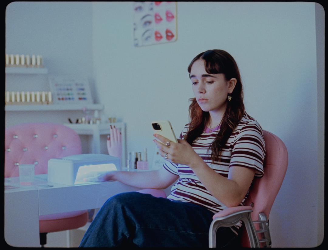 Female student with mobile phone