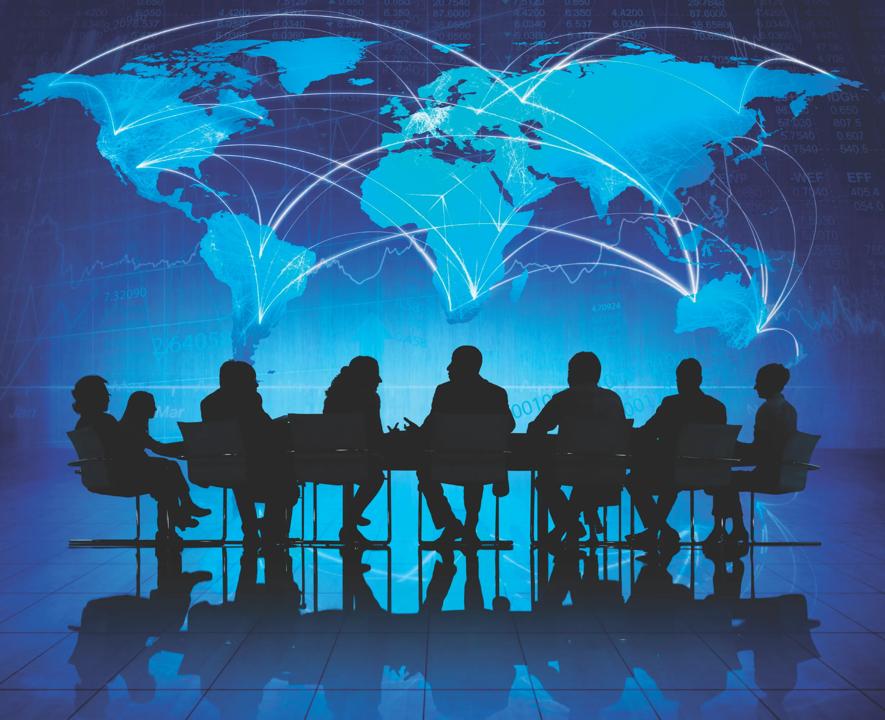 World map with people sitting at a table