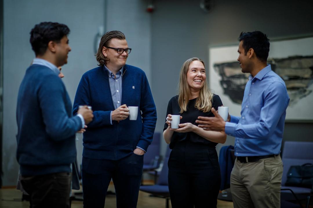 Four people mingling