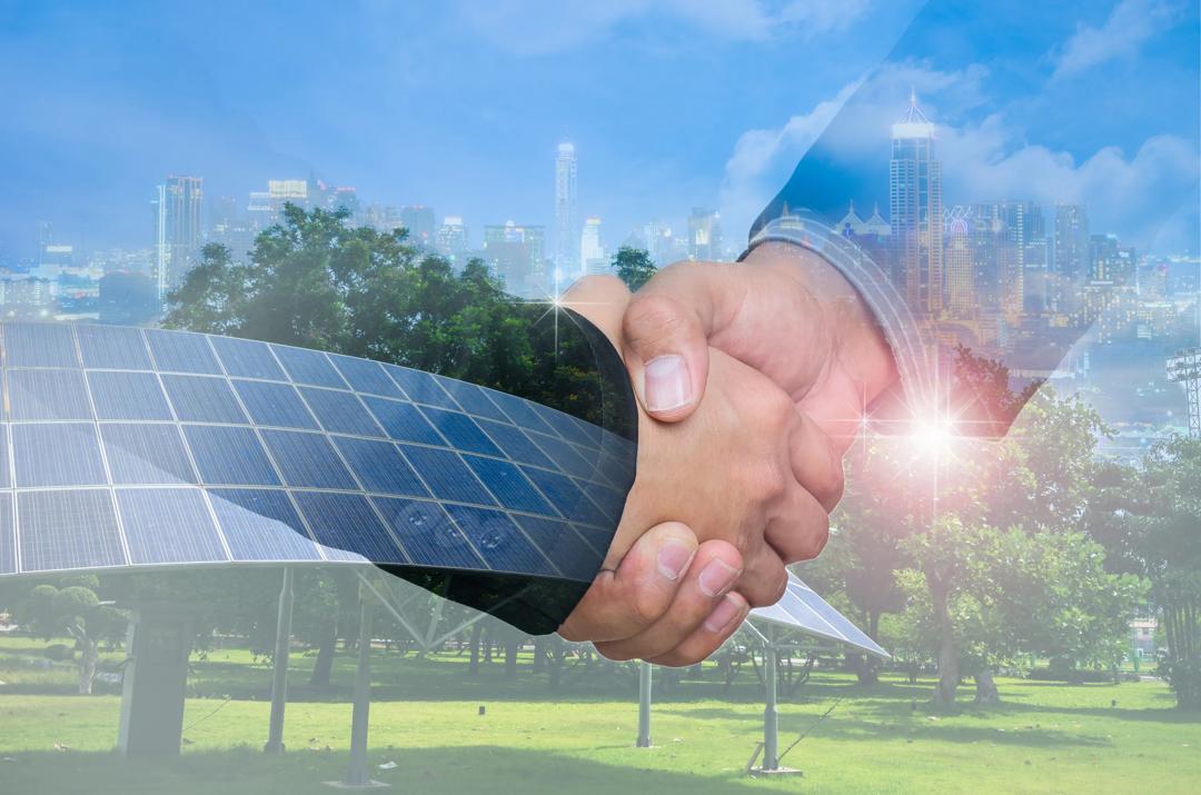 Double Exposure of a businessman handshake on the background blurred downtown nightlife. Concept of an agreement green energy.