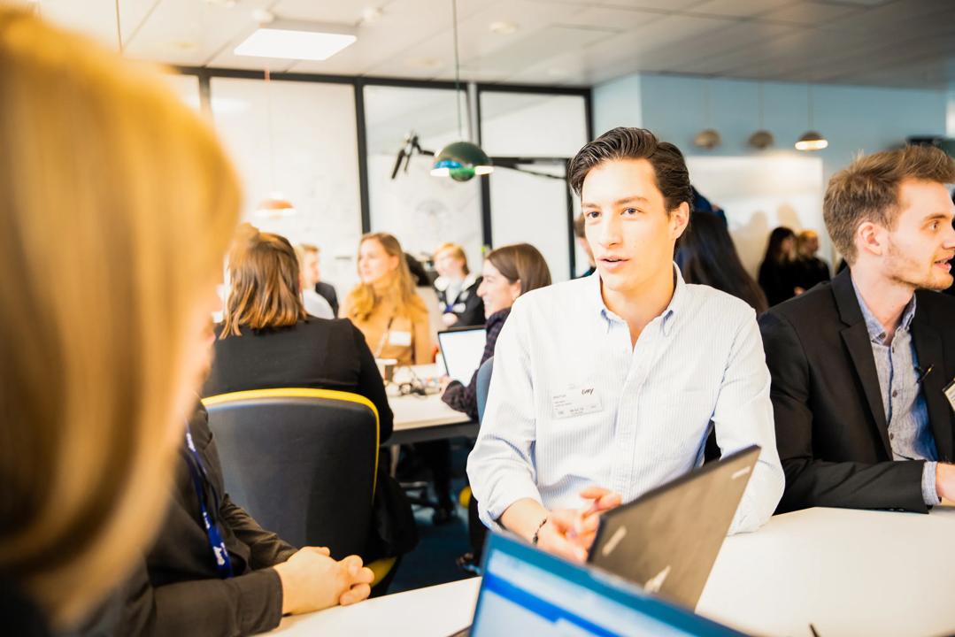 Two people talking at an office