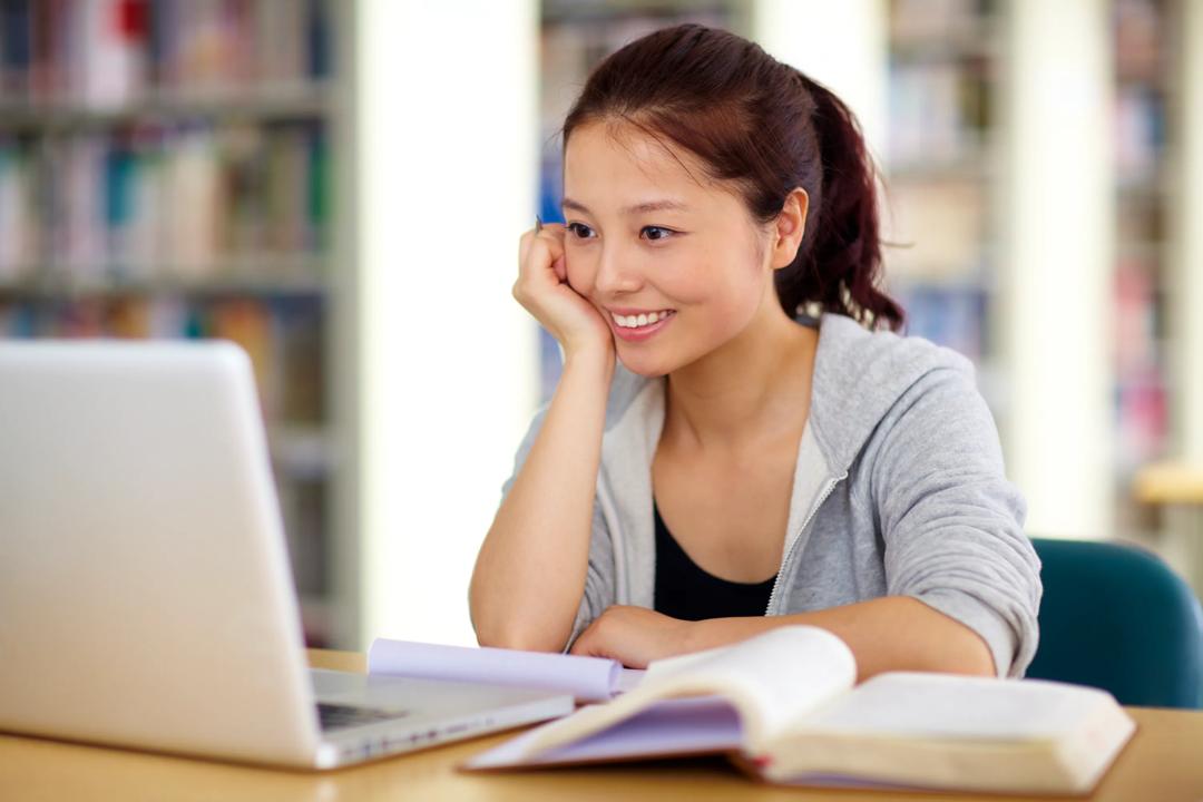 Student looking at a computer