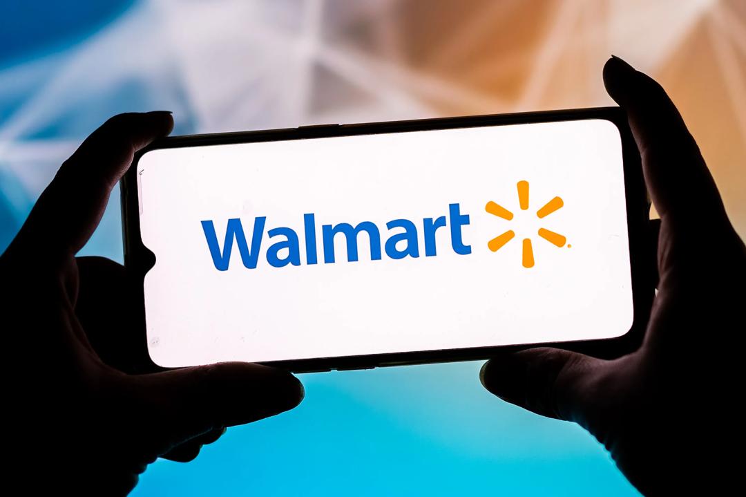 Identifiserer gårdsbruk: Walmart er i stand til å identifisere et gårdsbruk som har infiserte grønnsaker på 2,2 sekunder, skriver innsenderne. Her Walmart logo på en smarttelefon. (Foto: Mateusz Slodkowski / SOPA Images/Sipa USA).