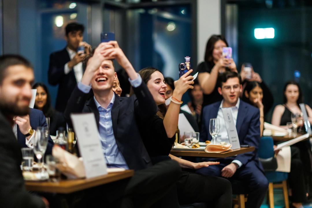 The award dinner from BIICC 2025. Students celebrating.