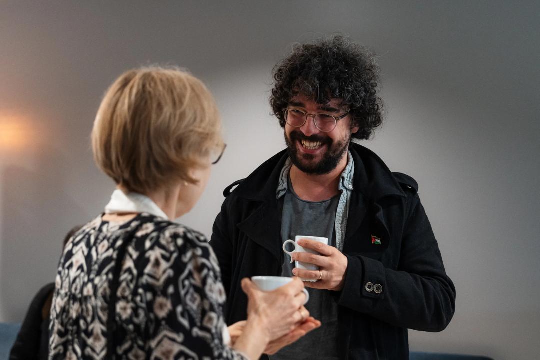 A man and woman mingling 