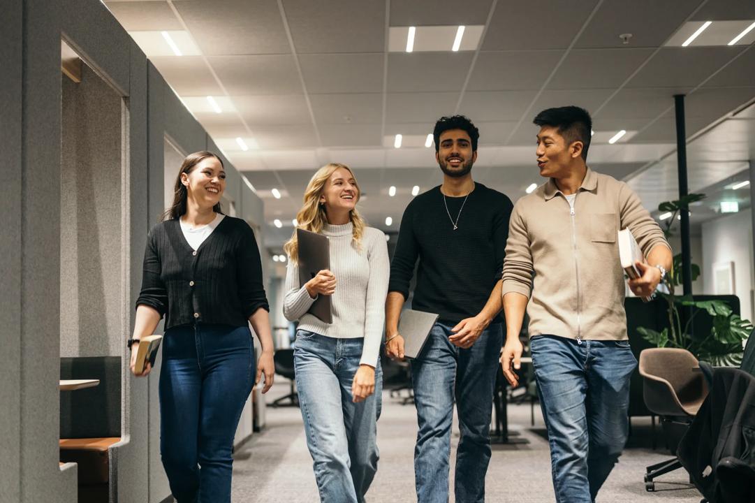 four students walking together