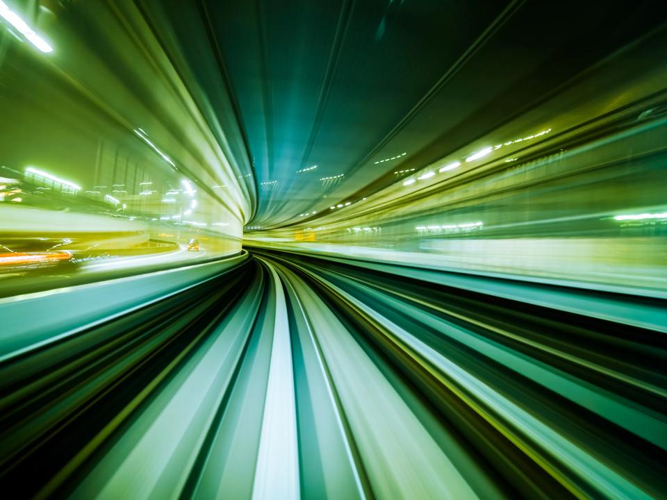 Motion blur train moving in city rail tunnel. Motion blur background abstract.